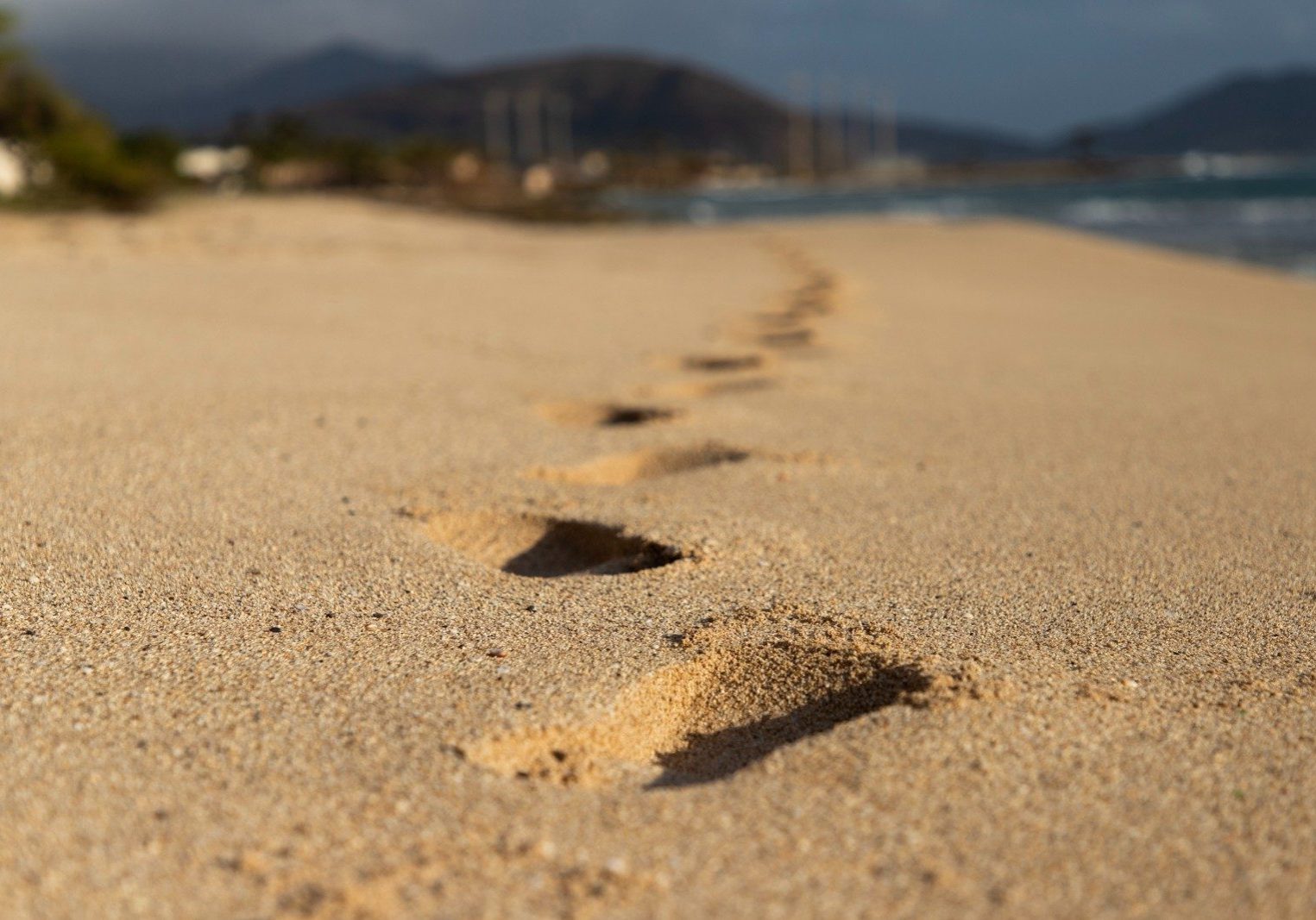 footprints on brown sand